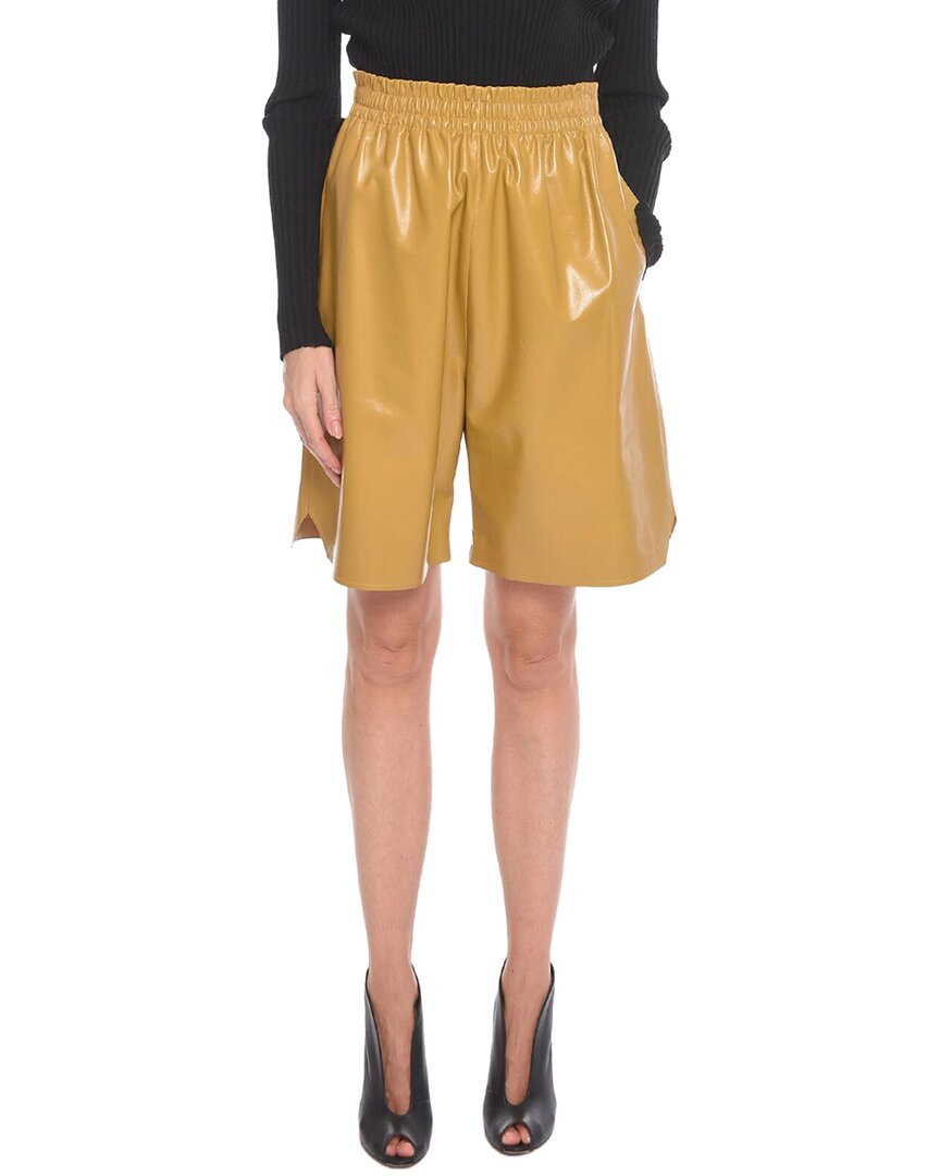 Shop Bottega Veneta Shiny Leather Gaucho Short In Yellow