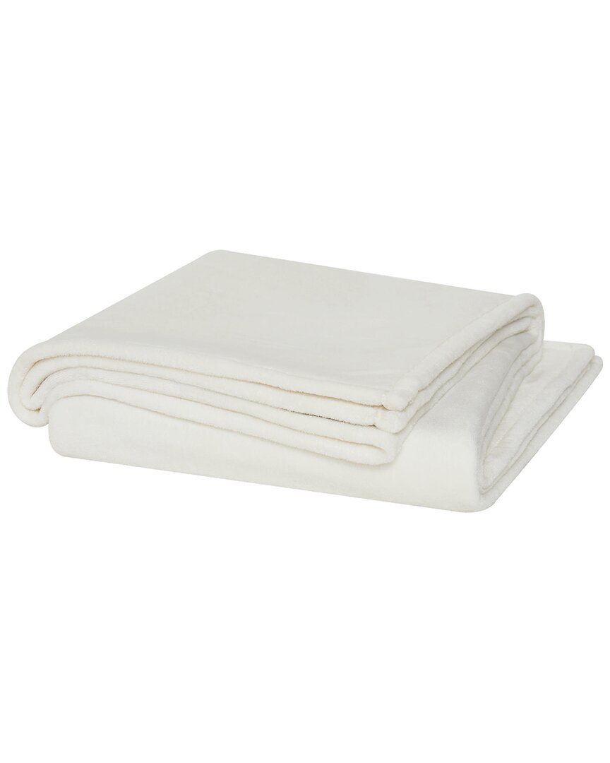 Shop Cannon Solid Plush Blanket In Ivory