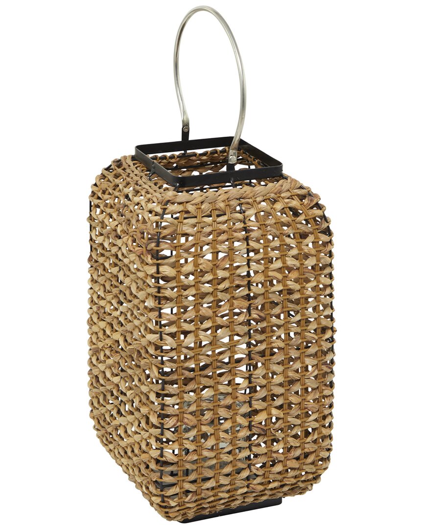 The Novogratz Brown Dried Plant Handmade Rattan Weaved Candle Lantern With Glass Holder And Handle